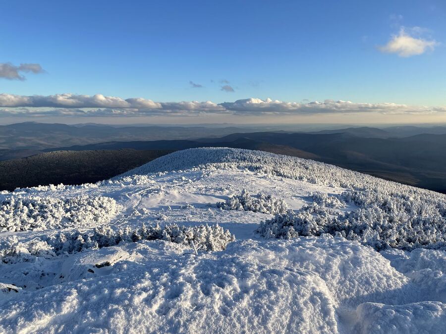 Rime-ice mounds on a summit in late light